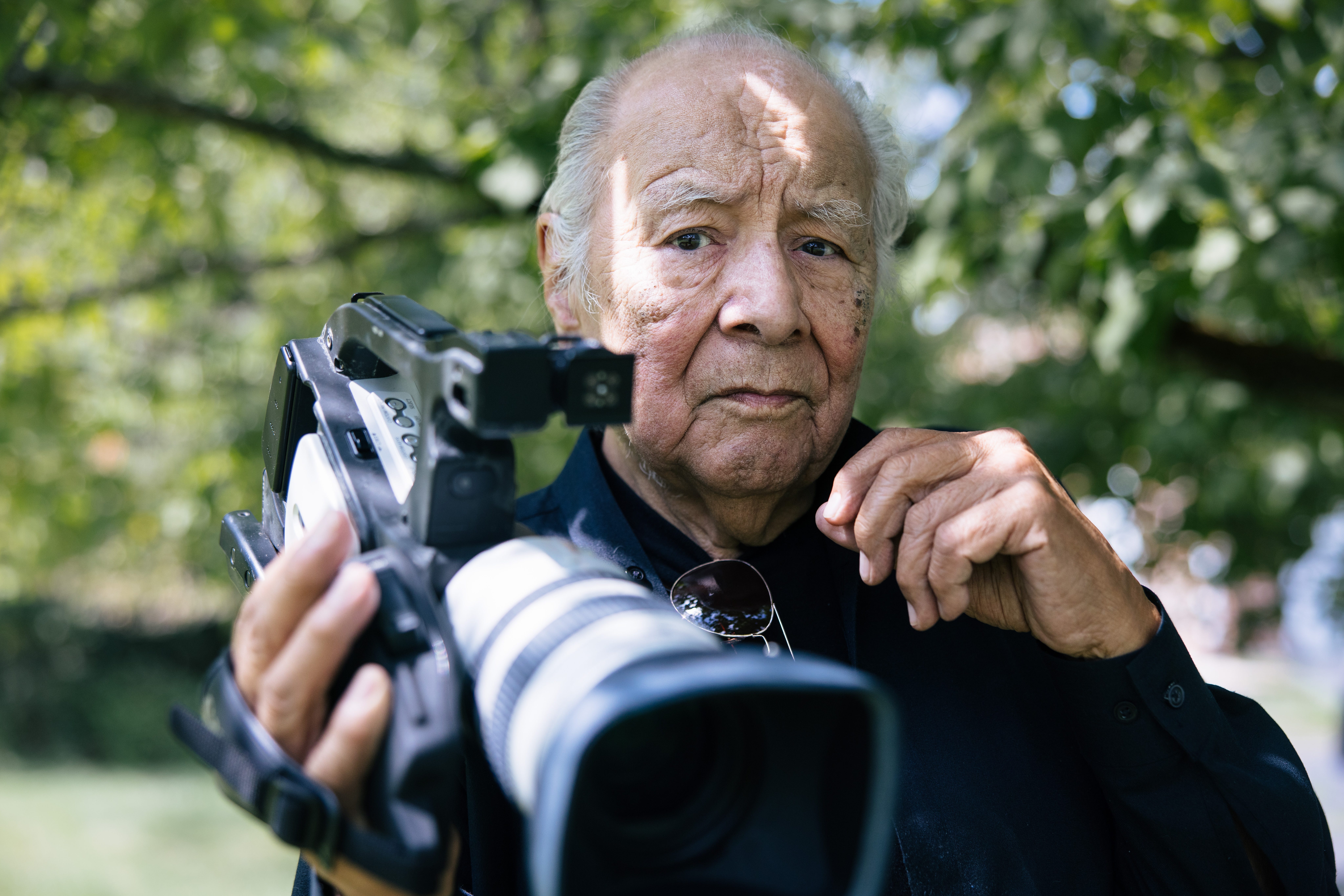 Henry Montez holds his video camera
