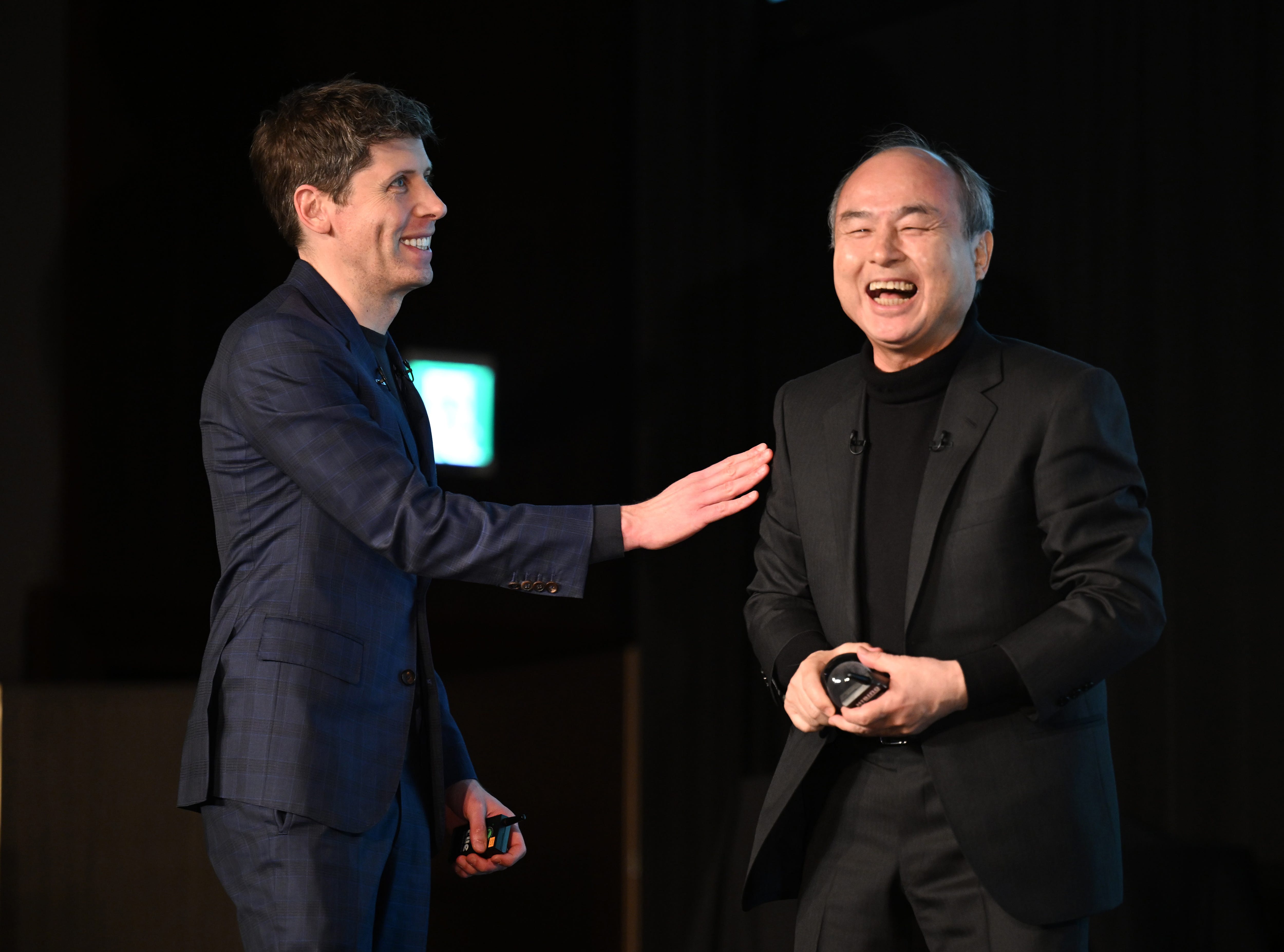 Sam Altman (left), CEO of OpenAI, and SoftBank CEO Masayoshi Son attend an event in Tokyo on February 3, 2025.