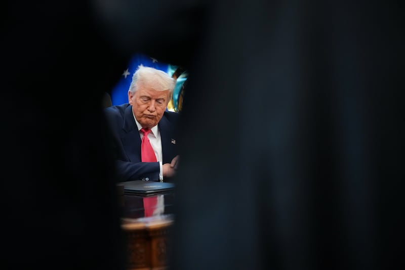 President Donald Trump answers questions from reporters in the Oval Office on August 14, 2025 in Washington, D.C.