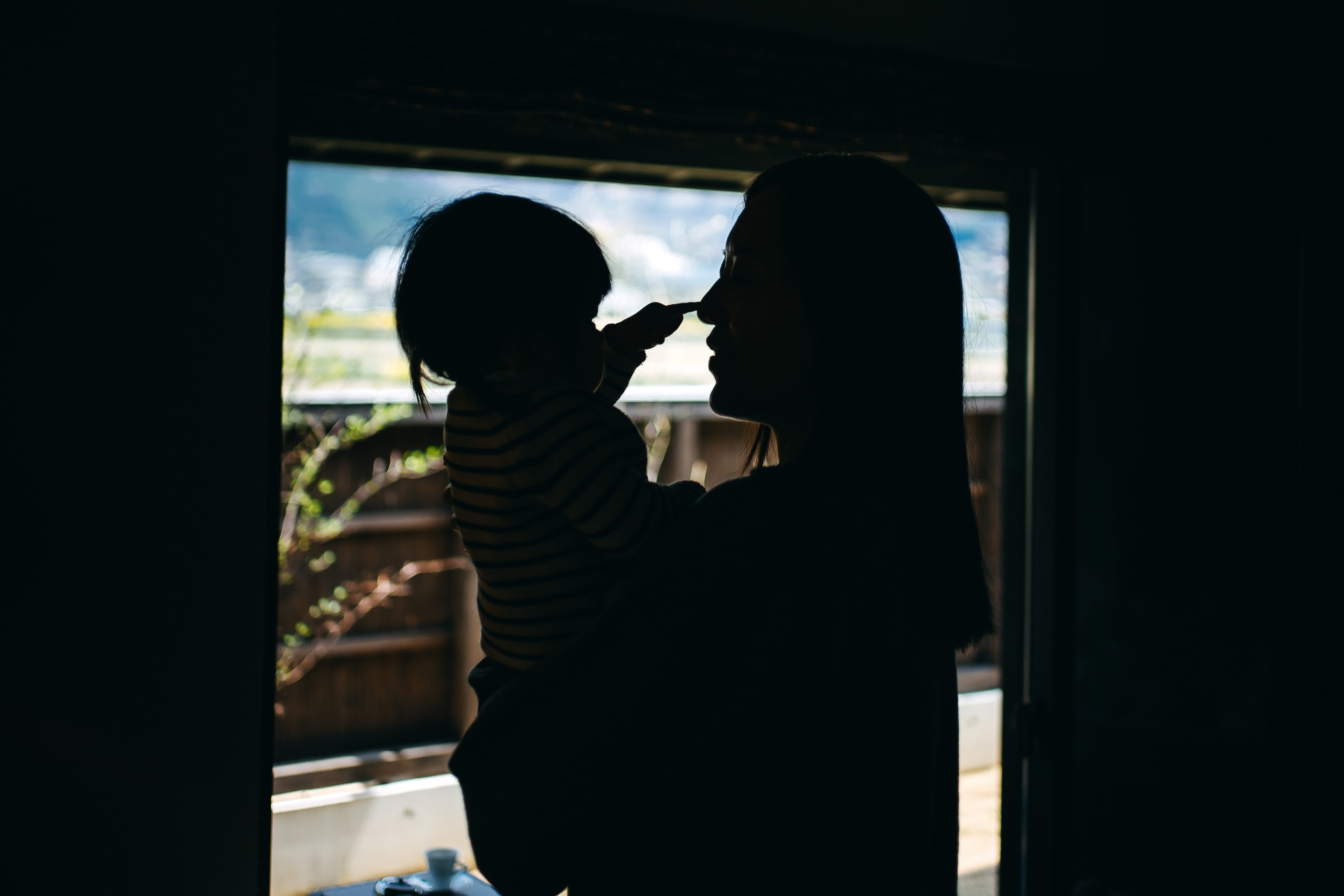 A mom holds her baby.