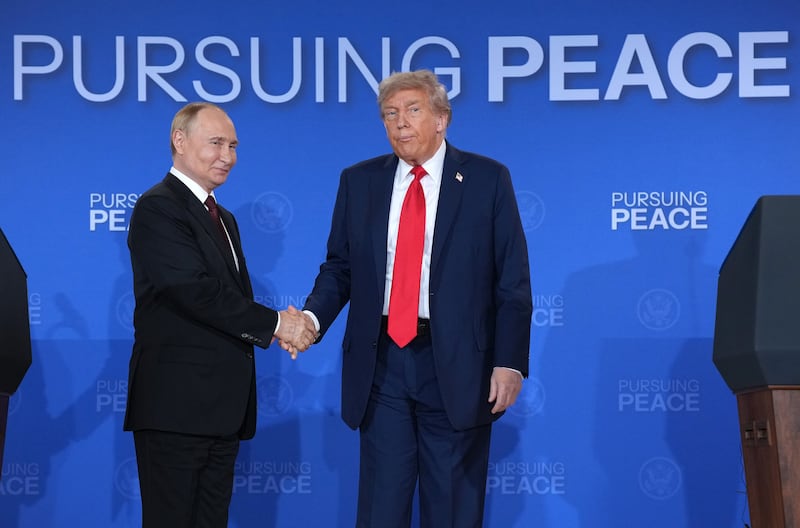President Donald Trump and Russian President Vladimir Putin shake hands at the end of a press conference at Joint Base Elmendorf-Richardson on August 15, 2025 in Anchorage, Alaska where they did not take any questions and did not reveal anything had been achieved at their meeting besides a promise for more talks.