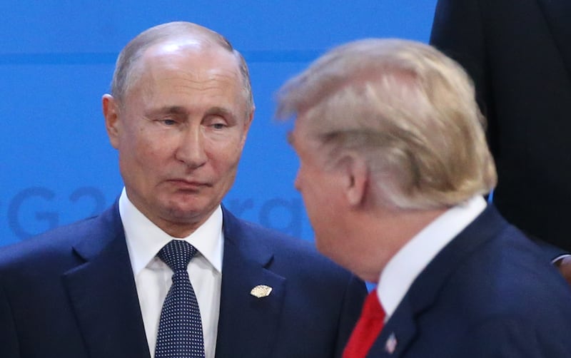 BUENOS AIRES, ARGENTINA - NOVEMBER 30: (RUSSIA OUT) Russian President Vladimir Putin (L) looks at U.S. President Donald Trump during the welcoming ceremony prior to the G20 Summit's Plenary Meeting on November 30, 2018 in Buenos Aires, Argentina. U.S. President Donald Trump cancelled his meeting with Vladimir Putin at the G20 Summit in Argentina planned for Saturday. (Photo by Mikhail Svetlov/Getty Images)