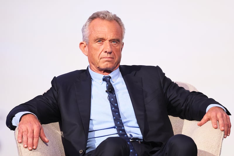 Robert F. Kennedy Jr. listens as he is introduced by Rabbi Shmuley Boteach during the World Values Network's Presidential candidate series at the Glasshouse on July 25, 2023 in New York City.