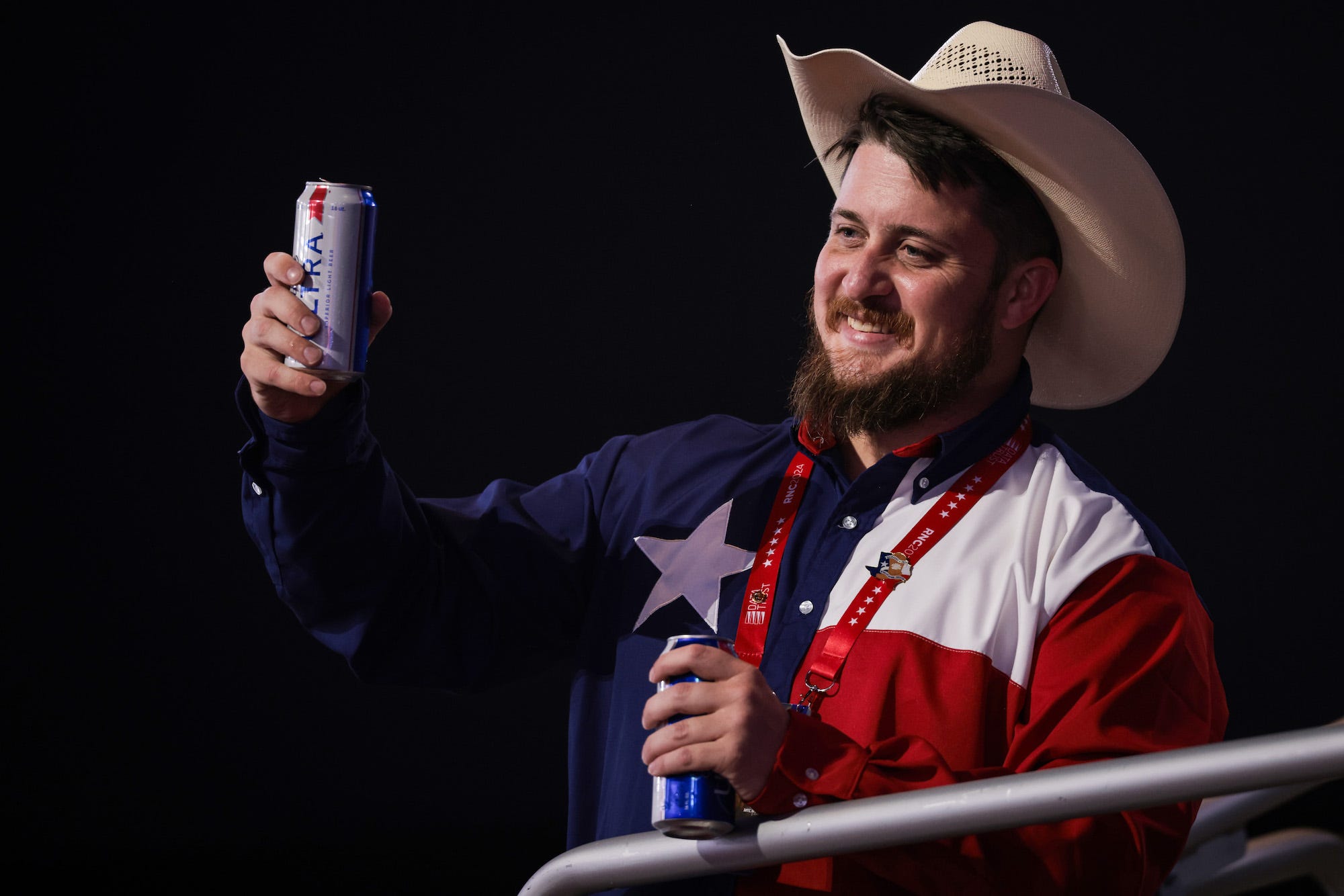 A man holds up a beer at the Republican National Convention in Milwaukee, Wisconsin in July 2024.