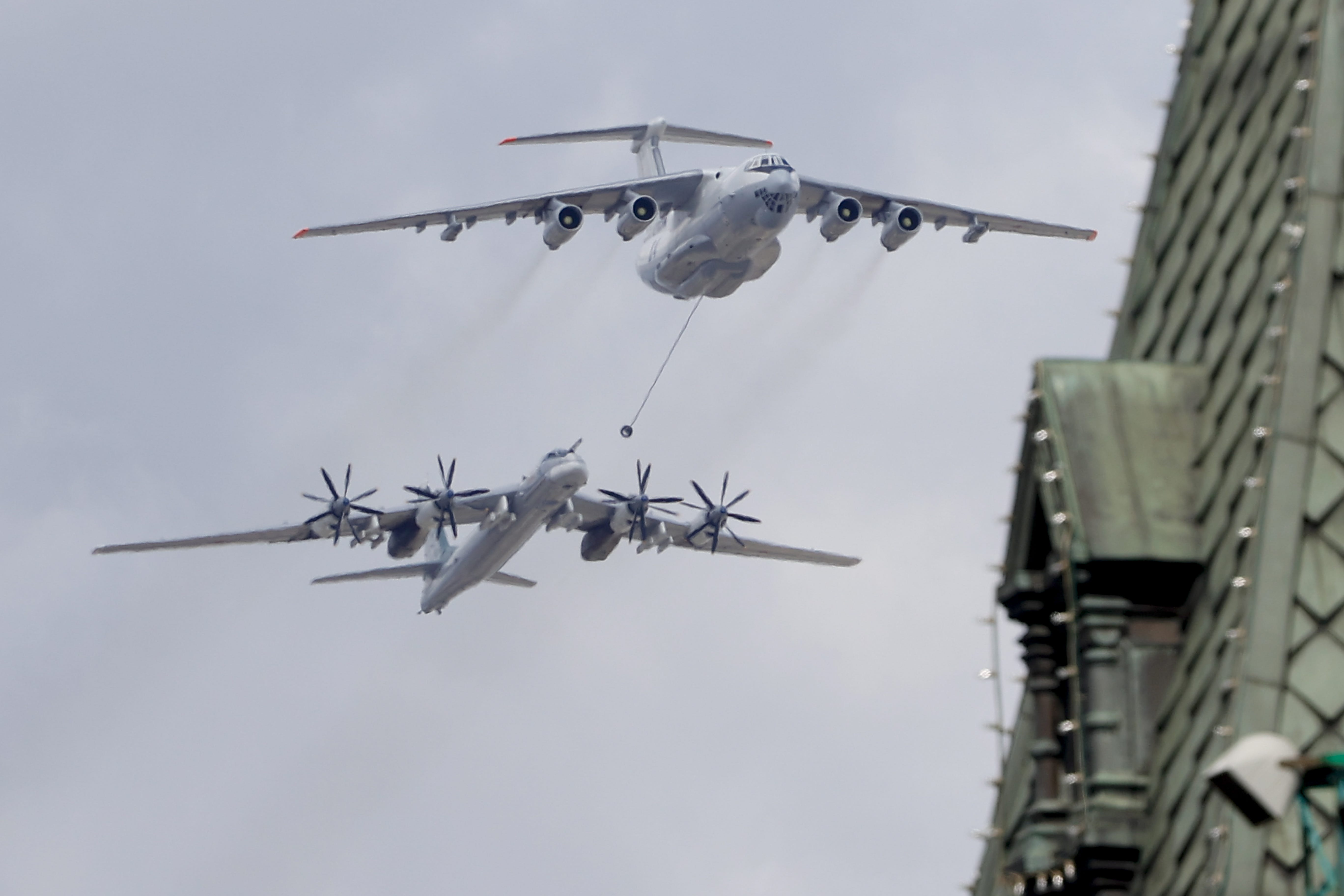 A Russian Tu-95 bomber and an IL-78 refueling plane fly over the Kremlin.
