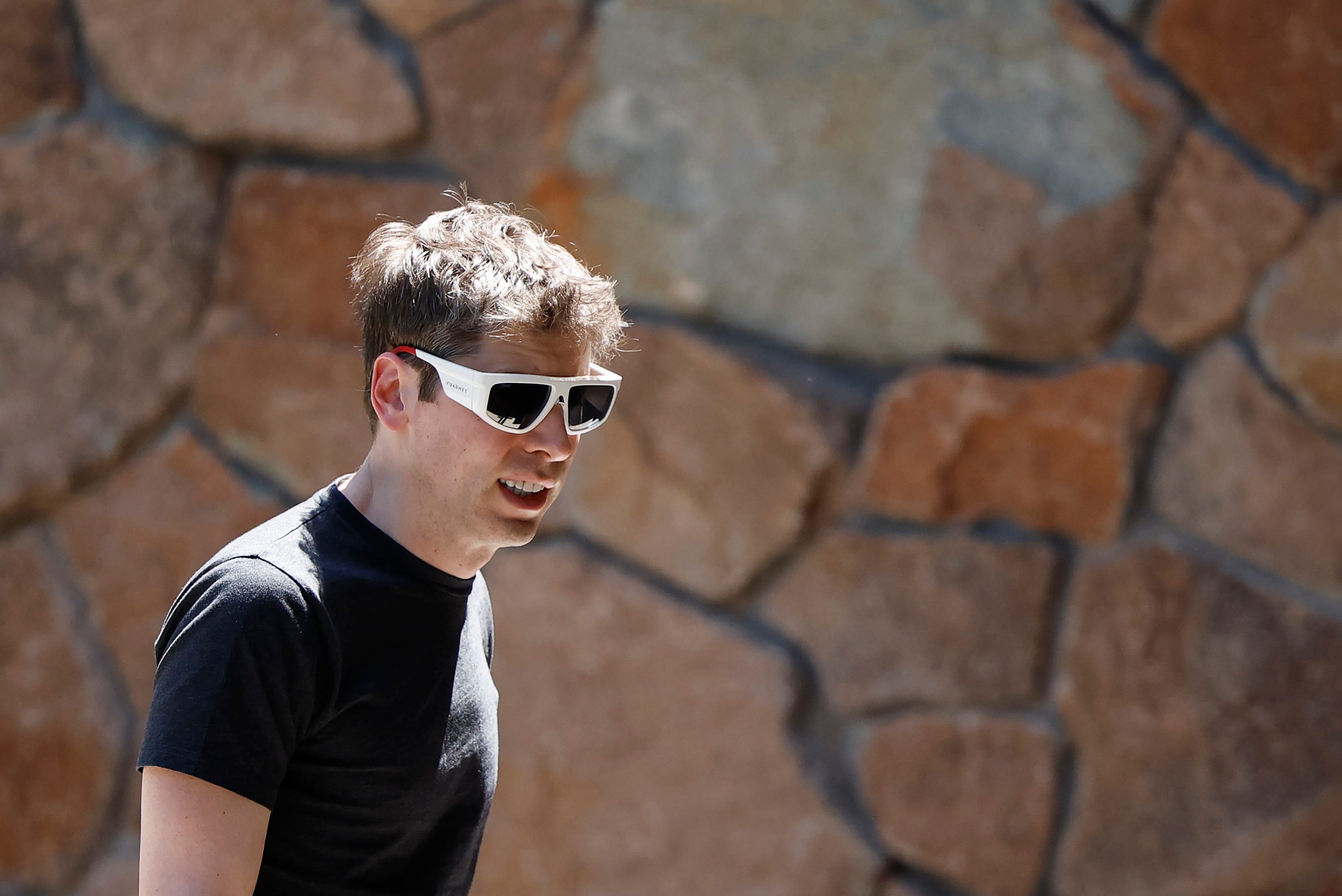 Sam Altman, CEO of OpenAI, wearing sunglasses