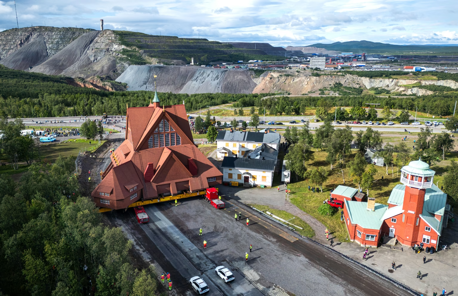The wooden Kiruna Church is being transferred three miles to a new location in Kiruna, Sweden.