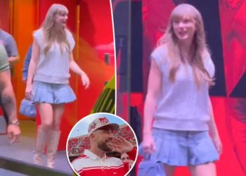 Taylor Swift pairs her new engagement ring with a pleated miniskirt at Nebraska vs. Cincinnati game