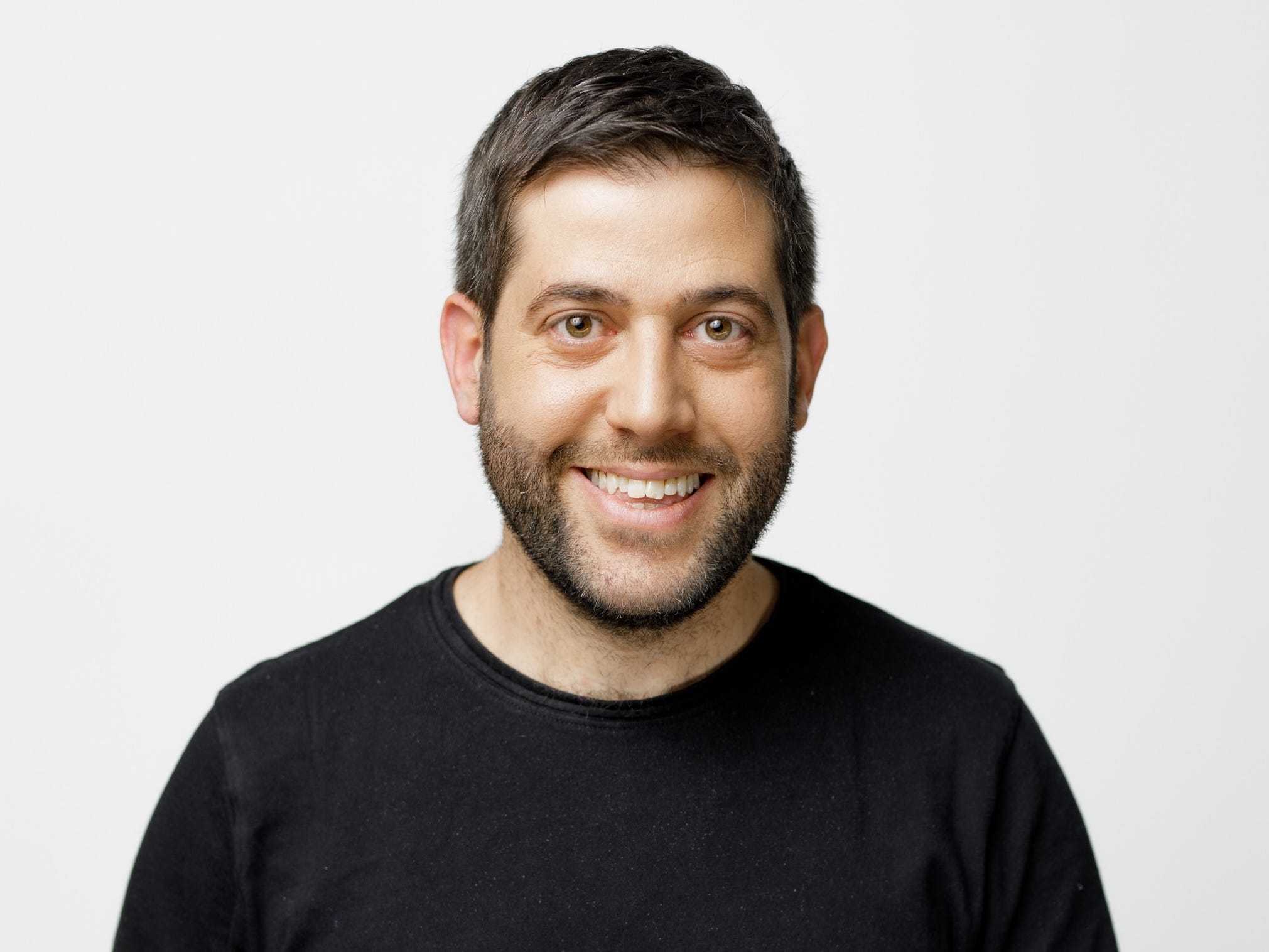 An Israeli man with cropped brown hair and a black T-shirt.