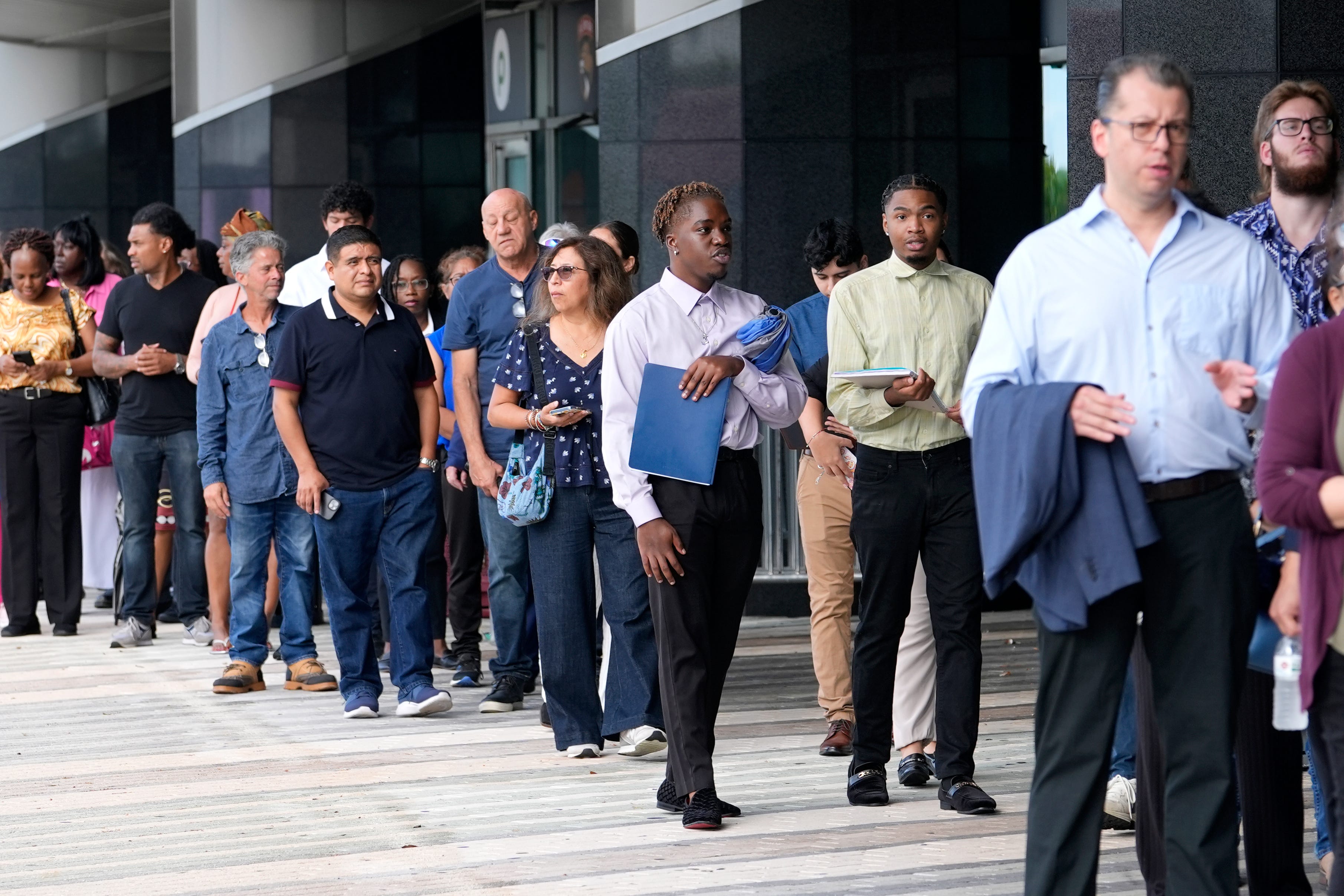 People waiting in line at a job fair.
