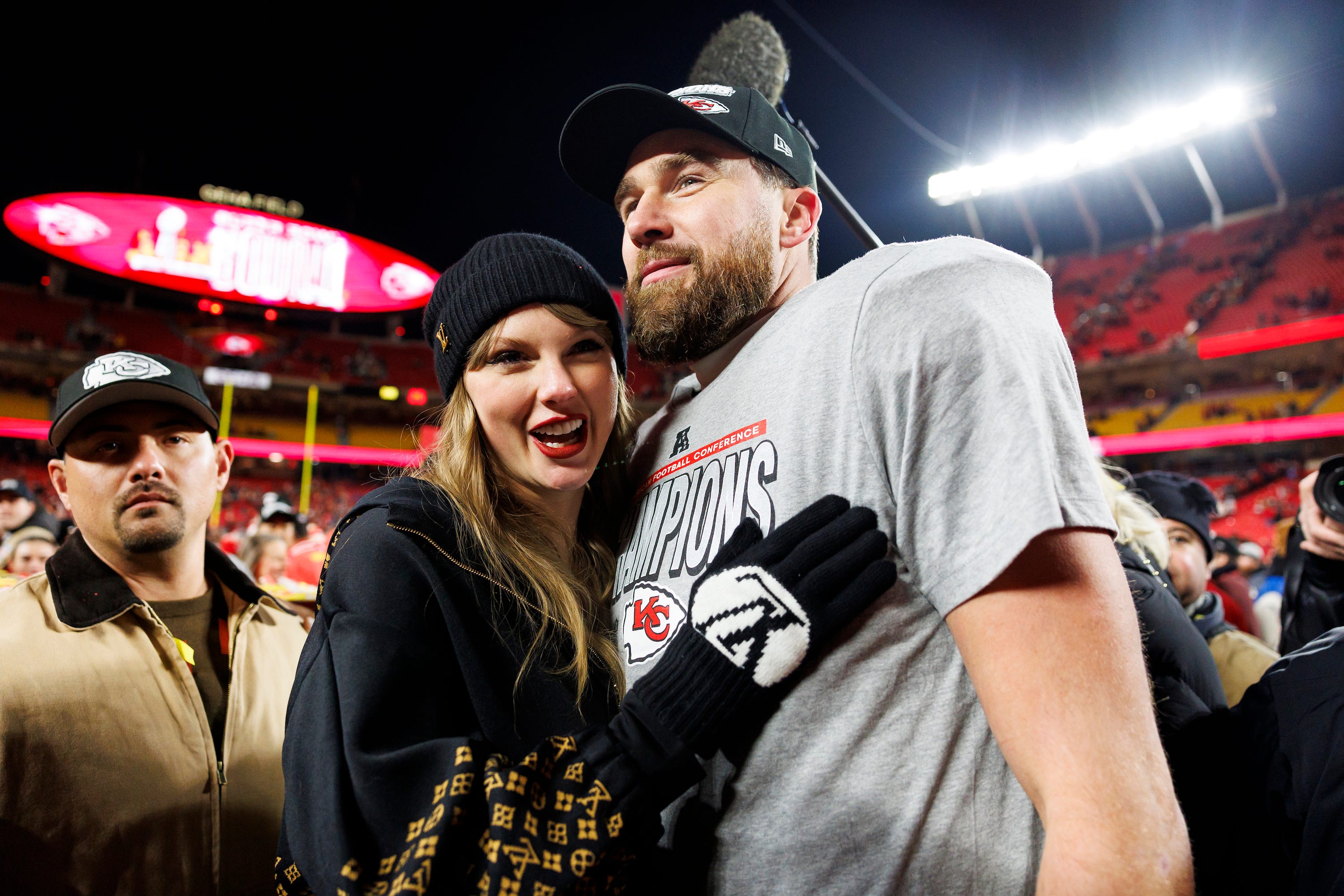 Taylor Swift and Travis Kelce embrace after the Kansas City Chiefs victory on January 26.