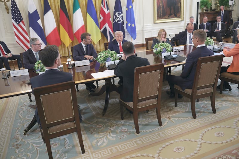 U.S. President Donald Trump sits at a conference table with Ukrainian President Volodymyr Zelensky, European Commission President Ursula von der Leyen, NATO Secretary-General Mark Rutte, and other European leaders at the White House on August 18, 2025 in Washington, DC.