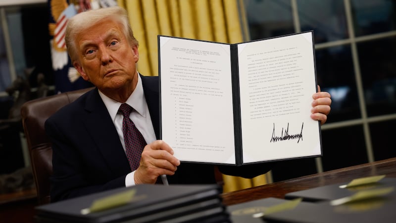 President Donald Trump signs executive orders in the Oval Office on January 20, 2025 in Washington, DC.