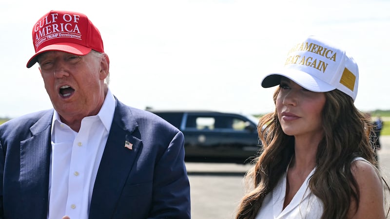 Donald Trump and Kristi Noem.