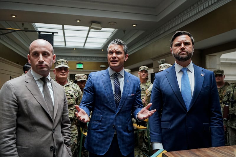 White House deputy chief of staff Stephen Miller, Defense Secretary Pete Hegseth and Vice President JD Vance talk to members of the National Guard at Union Station in Washington, DC on August 20, 2025.