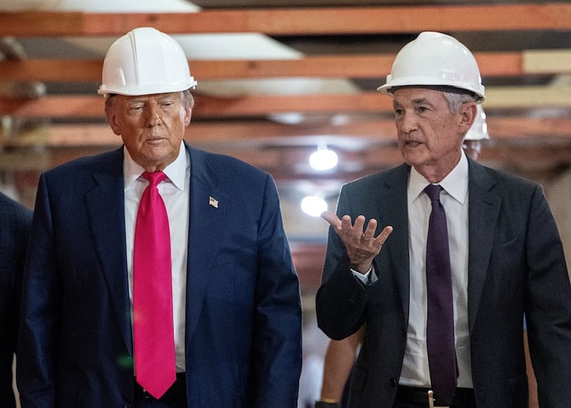 US President Donald Trump speaks with Federal Reserve chair Jerome Powell (R) as he visits the Federal Reserve in Washington, DC, on July 24, 2025. Trump arrived for a tour of the US Federal Reserve as the president escalates pressure on its chairman Jerome Powell over the central bank's management of the economy. Trump -- who wants to oust Powell for refusing to lower interest rates but likely lacks the legal authority -- has threatened to fire the Fed chief over cost overruns for a renovation of its Washington headquarters. (Photo by ANDREW CABALLERO-REYNOLDS / AFP) (Photo by ANDREW CABALLERO-REYNOLDS/AFP via Getty Images)