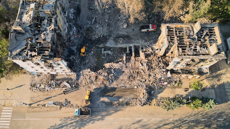 An aerial view as rescuers from Ukraine's emergency services search through the rubble of a building bombed by Russian forces on July 31, in an effort to recover the remains of victims on August 6, 2025 in Kramatorsk, Ukraine. The attack killed seven people and injured 11 others.