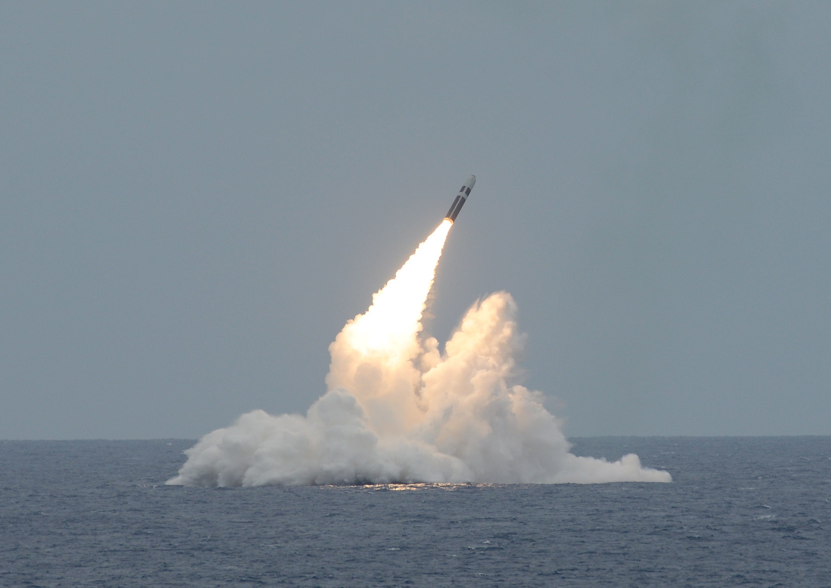 An unarmed Trident II D5 missile launches from the Ohio-class ballistic missile submarine USS Maryland off the coast of Florida.
