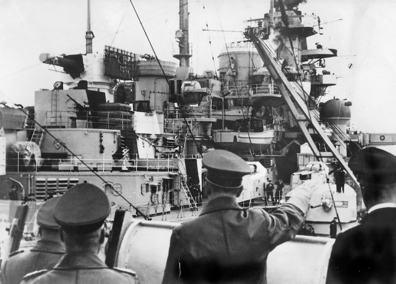 Adolf Hitler with captain Lindemann behind him admiral Gunther Lutjens and general Wilhelm Keitel aboard battleship Bismarck may 5, 1941 one hour before his last departure at the time of the Battle of the Atlantic/ (Photo by