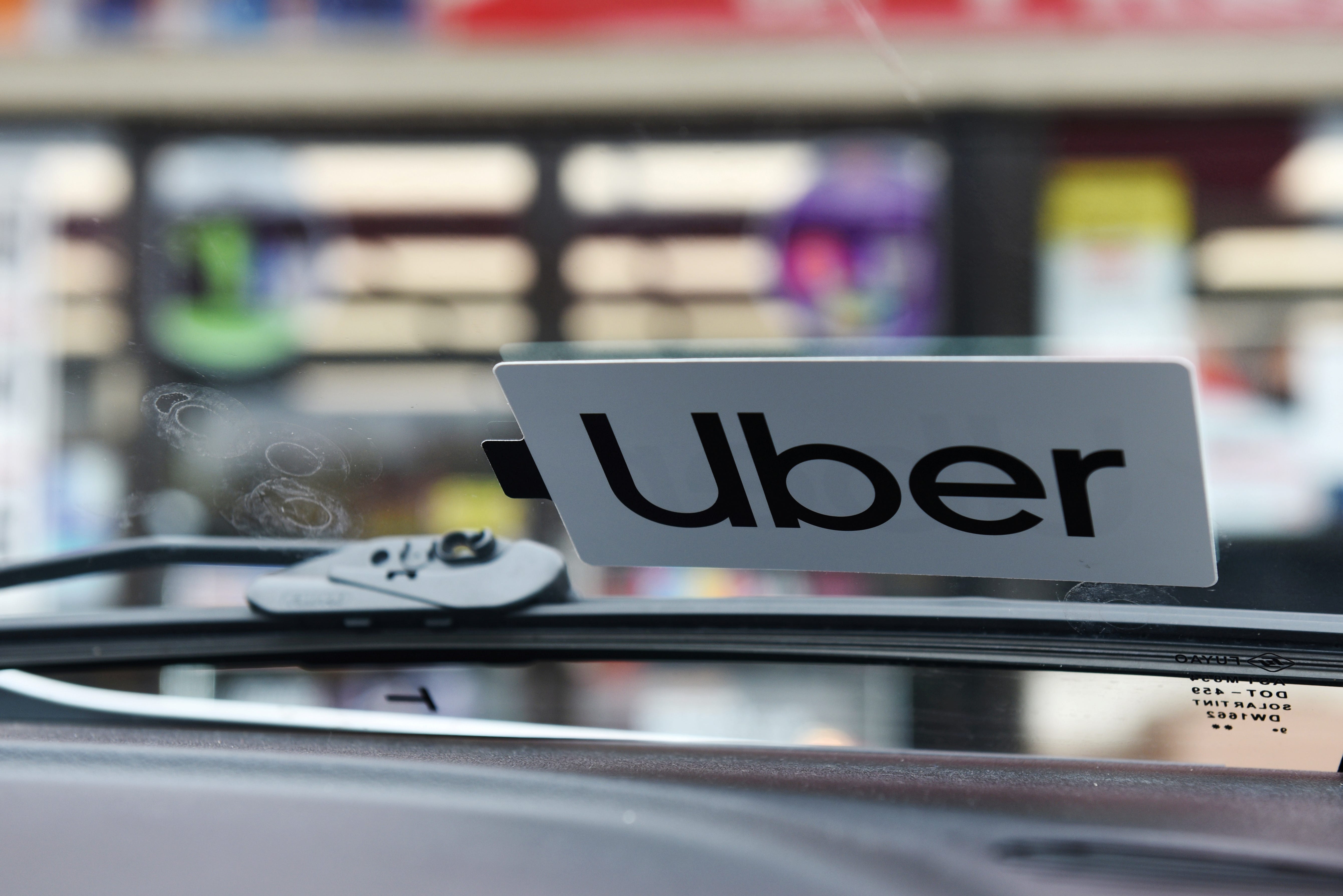 FILE PHOTO: An Uber sticker is seen on driver Margaret Bordelon's car in Lafayette, Louisiana, U.S. February 16, 2020. REUTERS/Callaghan O'Hare/File Photo