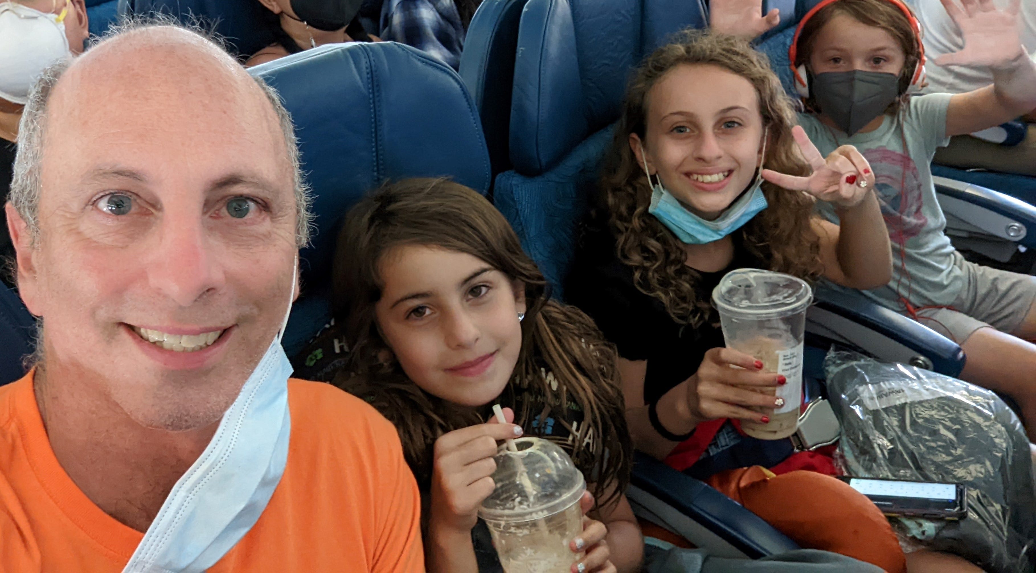 Author 
Scott Tharler and his kids on a plane