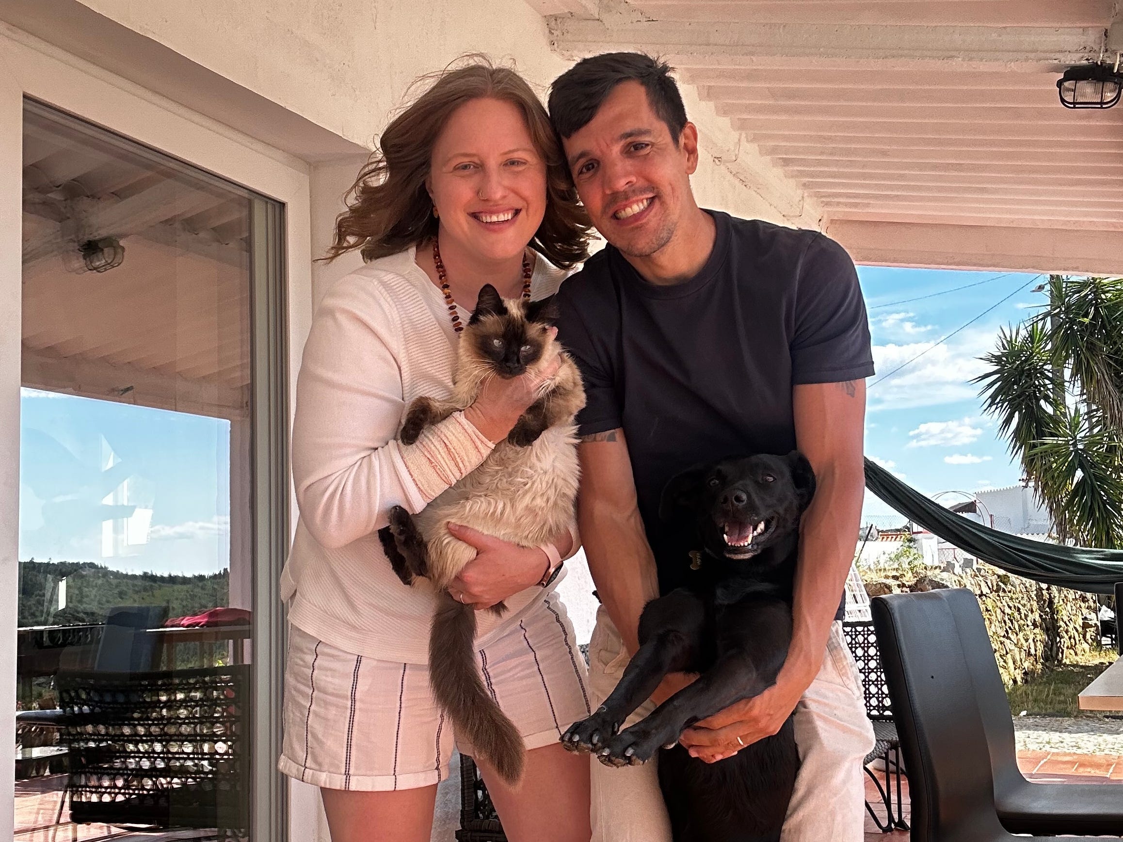 Author Yvonne Ivanescu, cat, and partner at home in Portugal