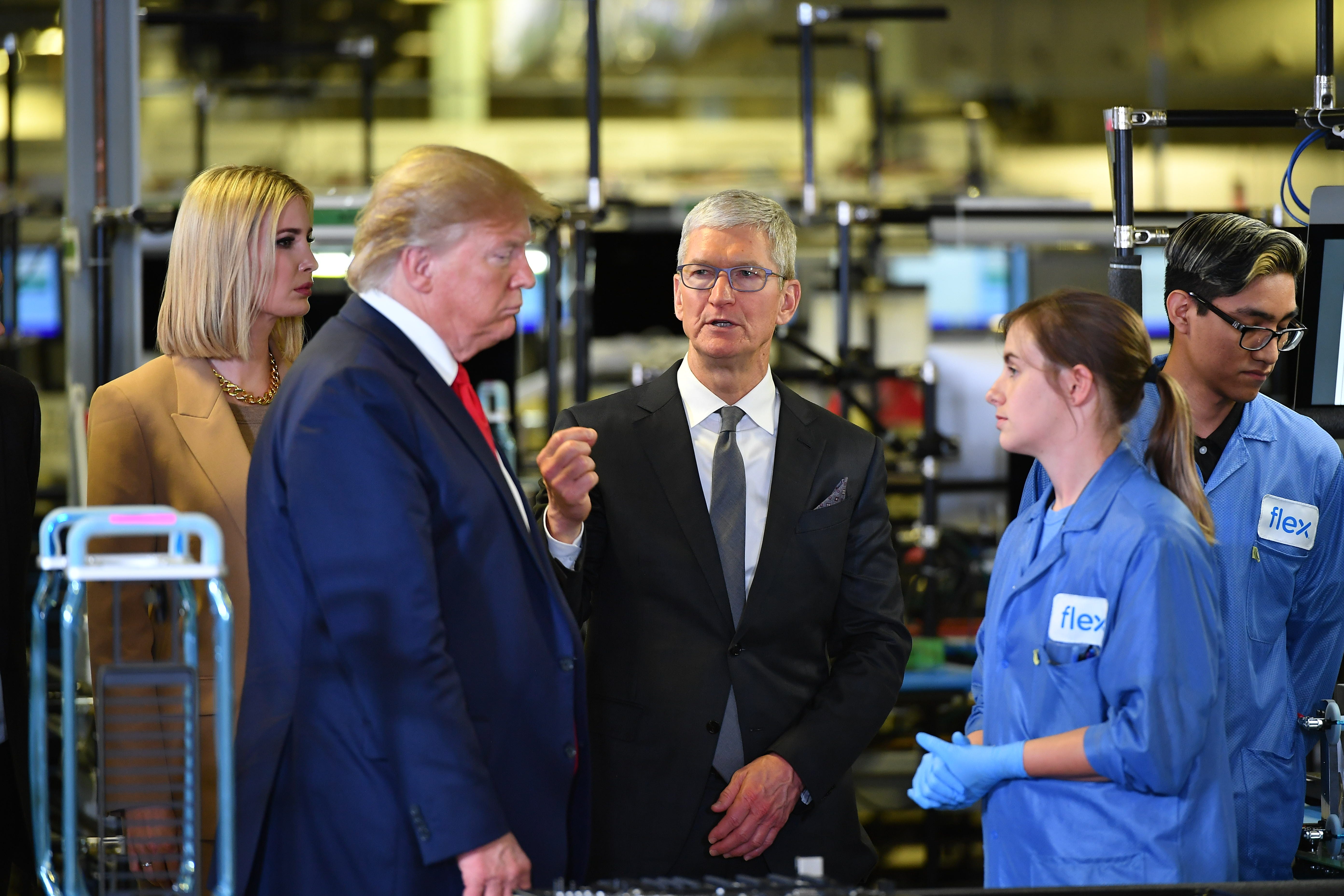 Donald Trump and Apple CEO Tim Cook tour a Flextronics plant in Texas that makes Apple Mac computers, November 2019