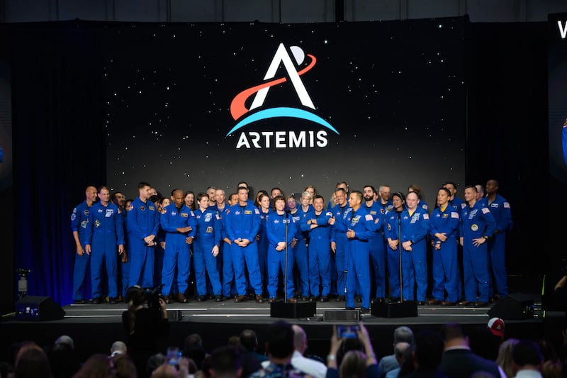TOPSHOT - Current NASA astronauts stand on stage before a news conference held by NASA and CSA to announce the four astronauts who will venture around the Moon, at Ellington airport in Houston, Texas, on April 3, 2023. - Traveling aboard NASAs Orion spacecraft during Artemis II, the mission is the first crewed flight test on the agencys path to establishing a long-term scientific and human presence on the lunar surface. (Photo by Mark Felix / AFP) (Photo by MARK FELIX/AFP via Getty Images)