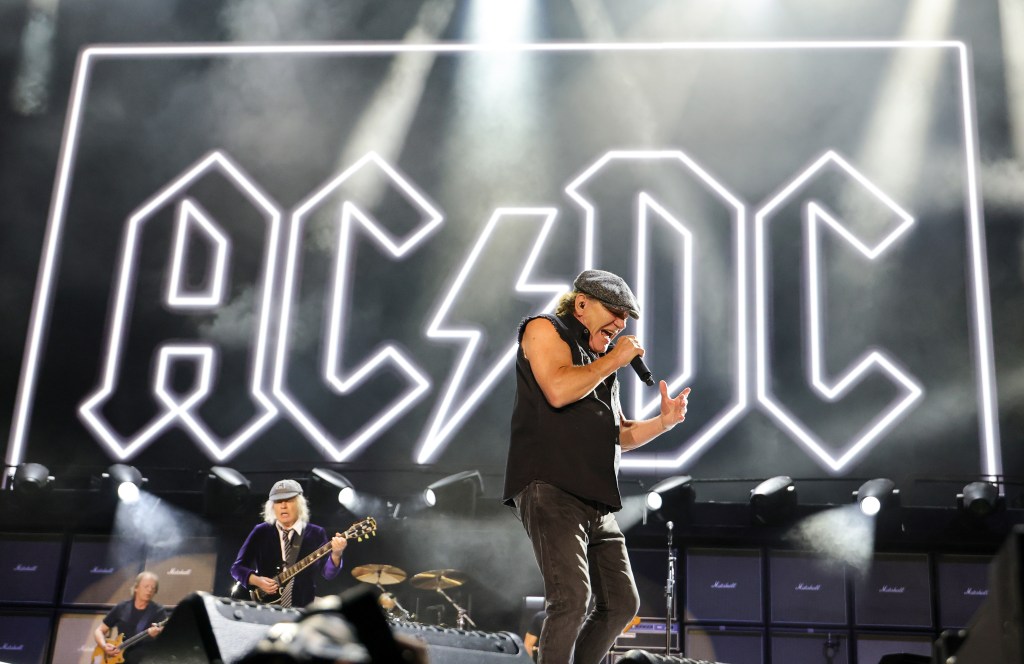 AC/DC performing live on stage.