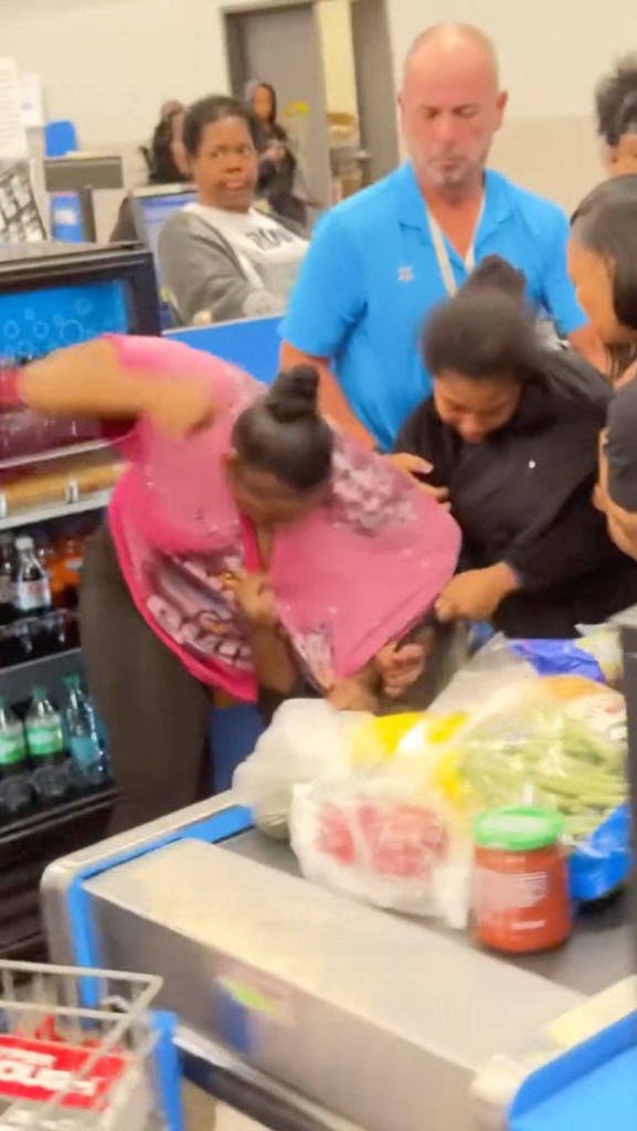 Disturbing footage from an Indianapolis Walmart, filmed Friday and posted to Facebook by witness Kind Butler, shows a woman in black holding back a female employee while two other women pummel her at the checkout aisle.