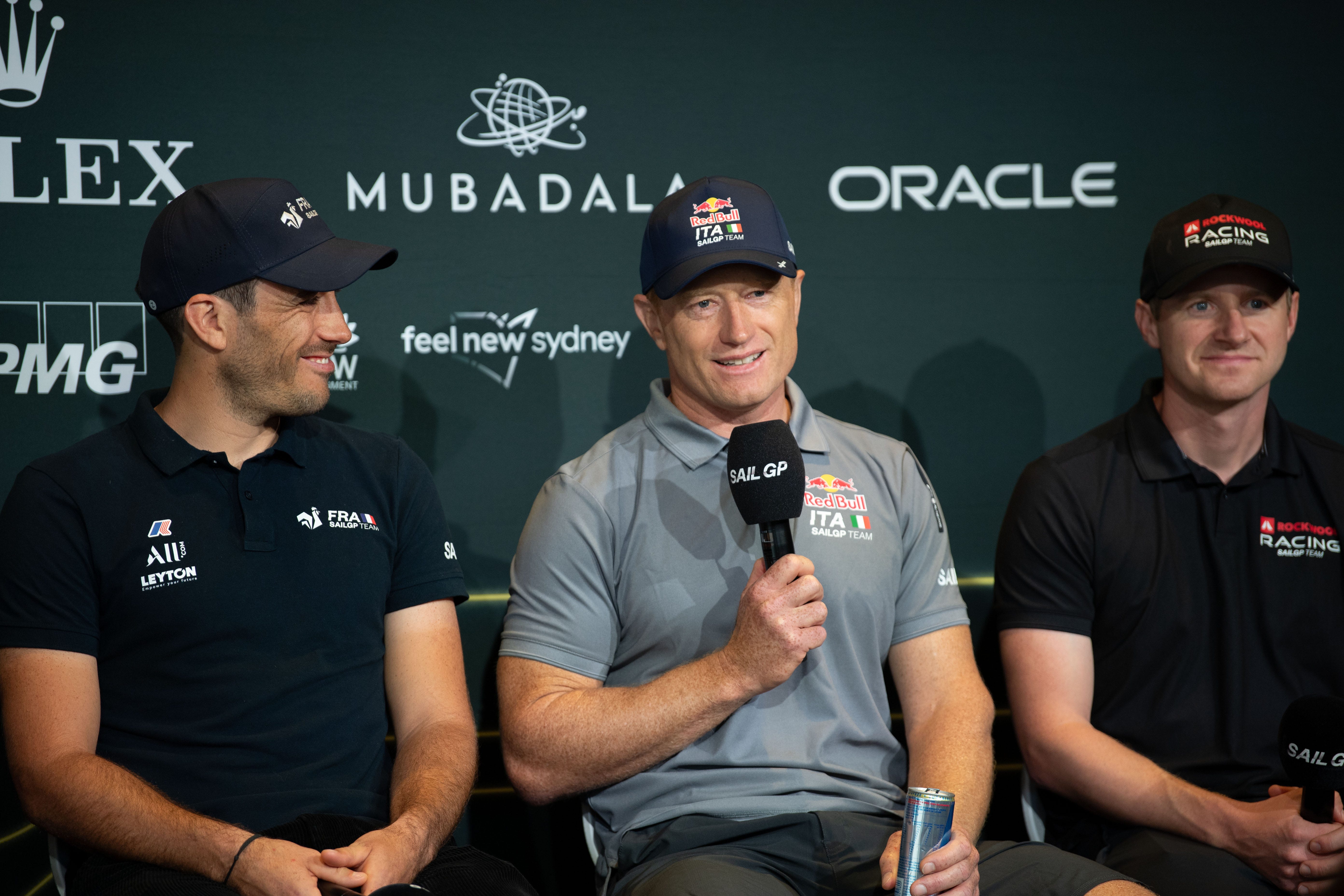 three men at a press conference