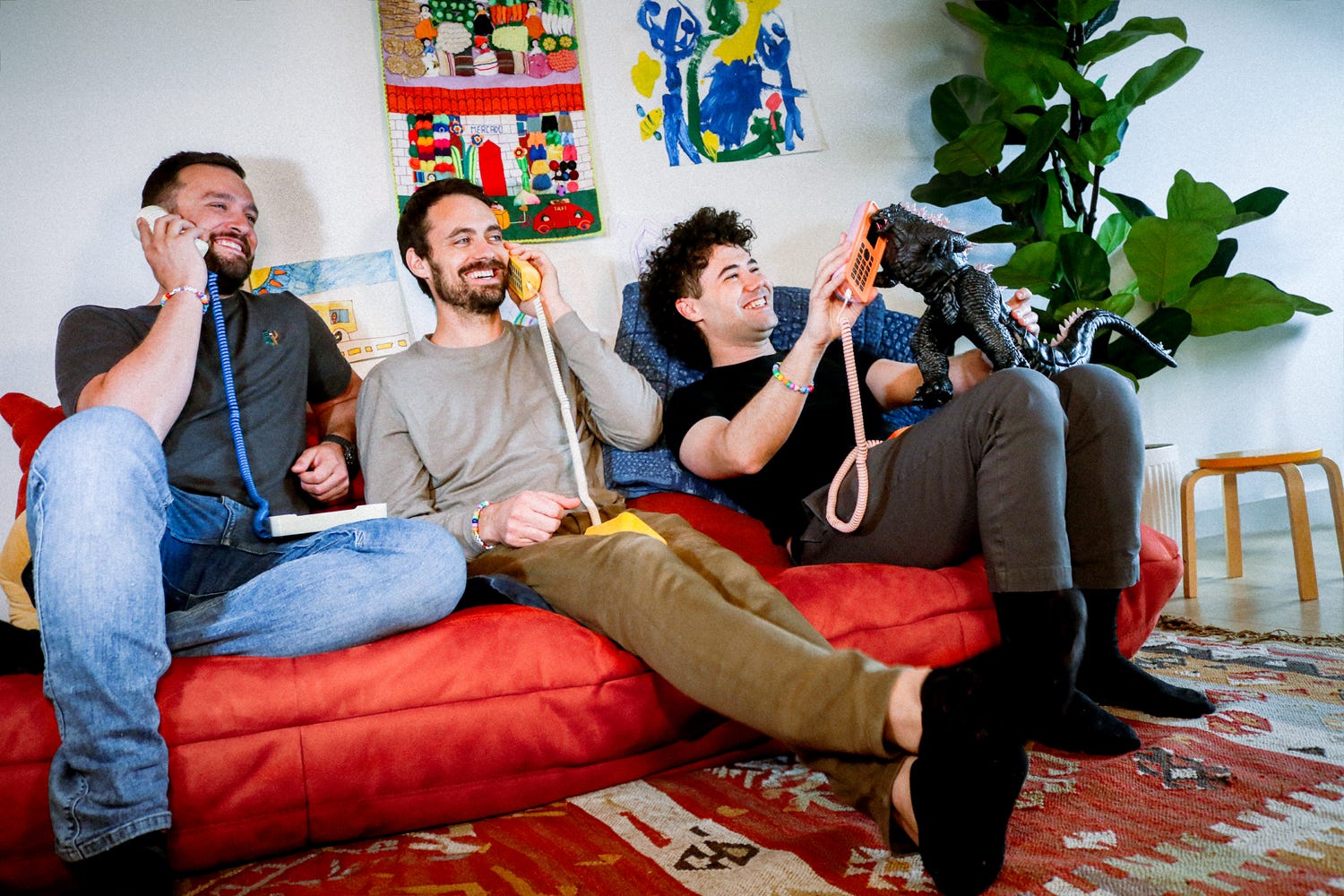 three men on a couch