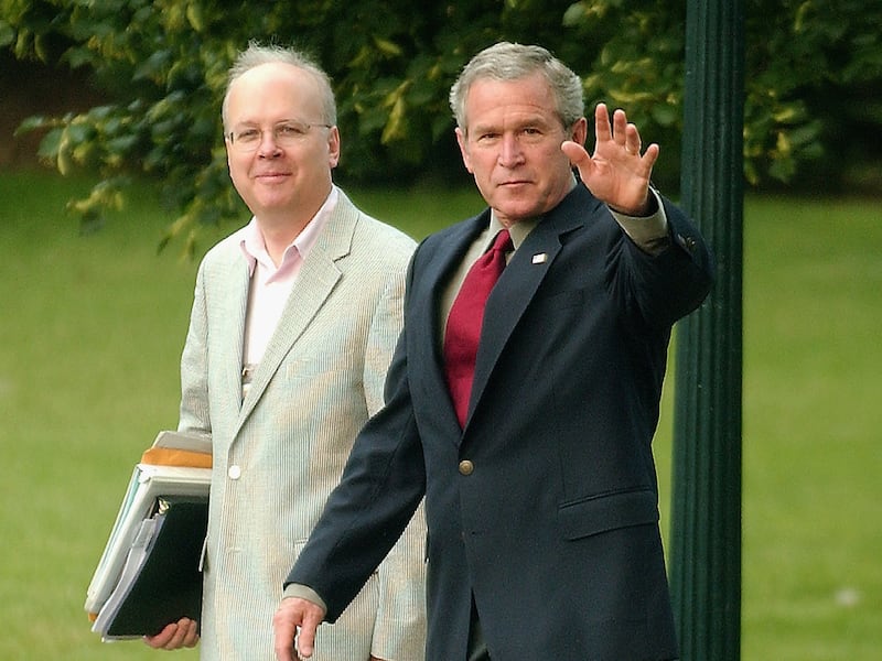 WASHINGTON, D.C. - JULY 4: United States President George W. Bush, accompanied by senior advisor Karl Rove, waves to the cameras as he prepares to depart the south lawn of the White House via Marine One to visit the United States Army Special Command in Fort Bragg, North Carolina July 4, 2006 in Washington, D.C. The President is visiting Fort Bragg to celebrate Independence Day. (Photo by Ron Sachs - Pool/Getty Images)