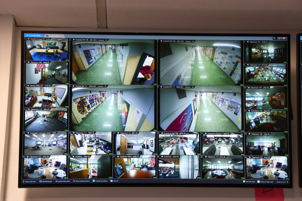 Security monitor displaying live feeds from multiple cameras in a school.