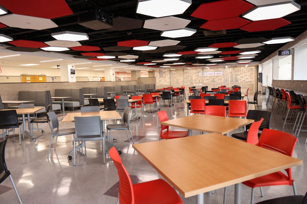 Plainedge High School cafeteria with tables and chairs.