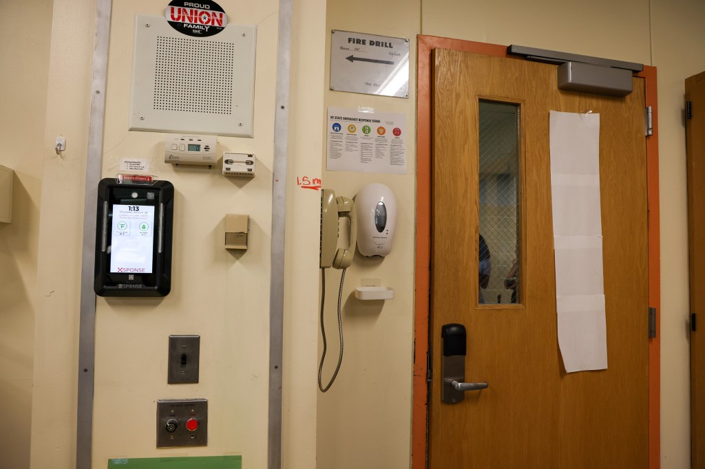 Plainedge High School hallway with security system and emergency equipment.