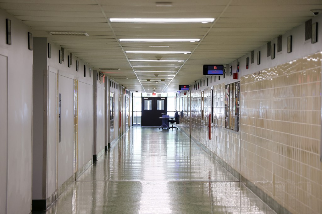Empty high school hallway with new security system.