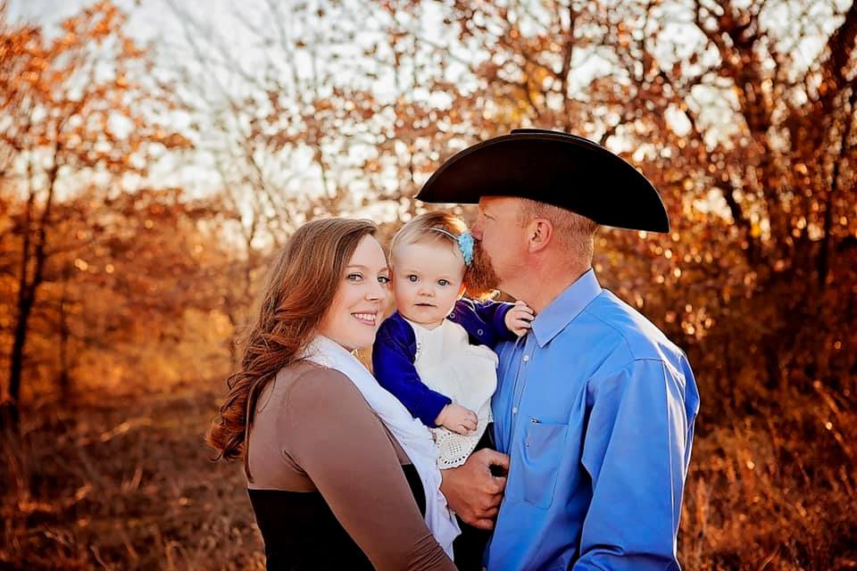 Family portrait of Paul Slough with his wife and daughter.