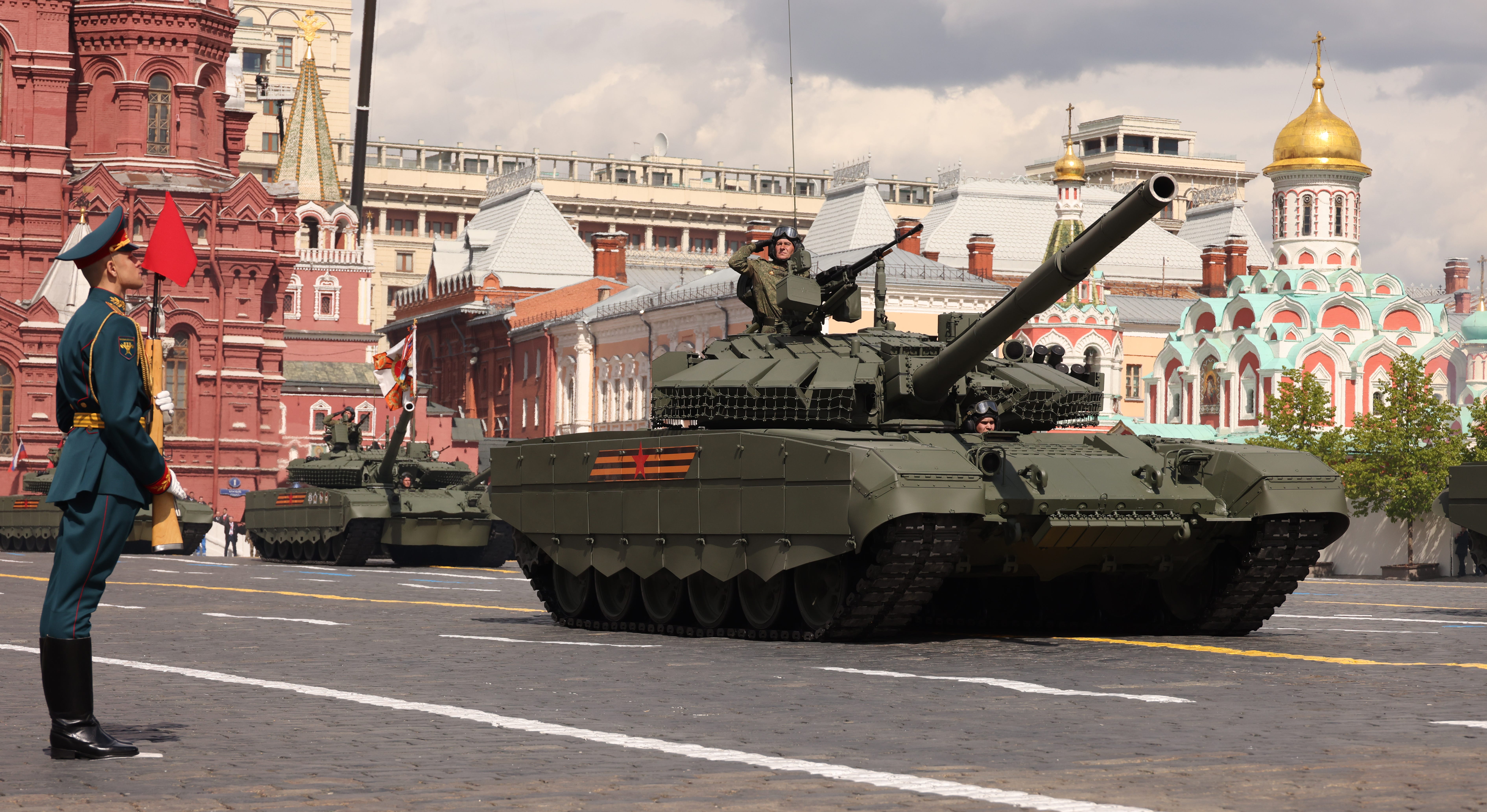 Russian officers ride Armata T-14 tanks during a Red Square rehearsal for Victory Day.