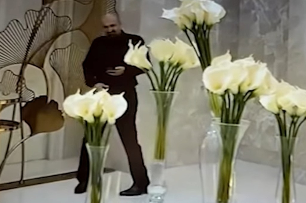 Surveillance footage of a man stealing from a wedding reception.