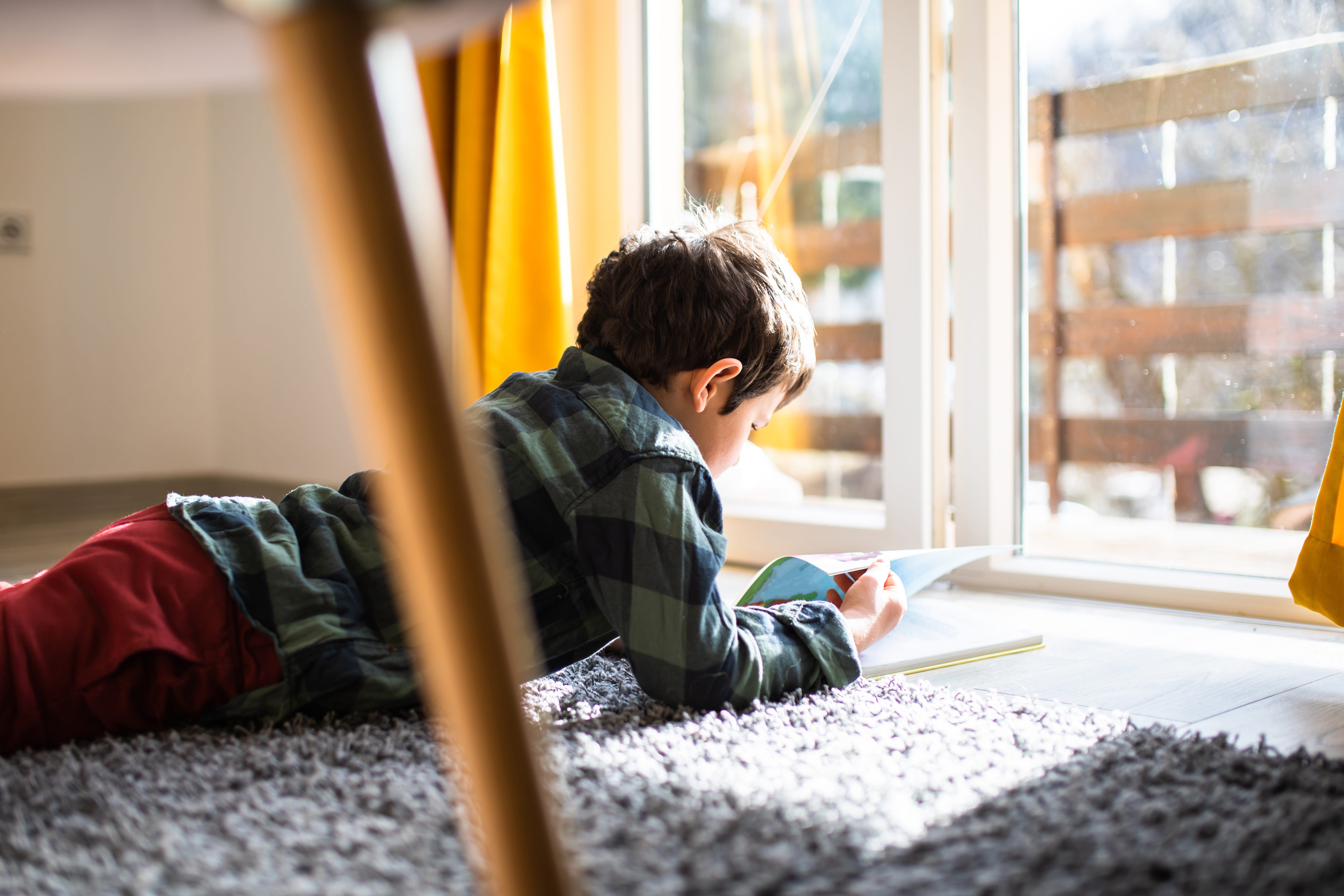 Kid reading on the floor