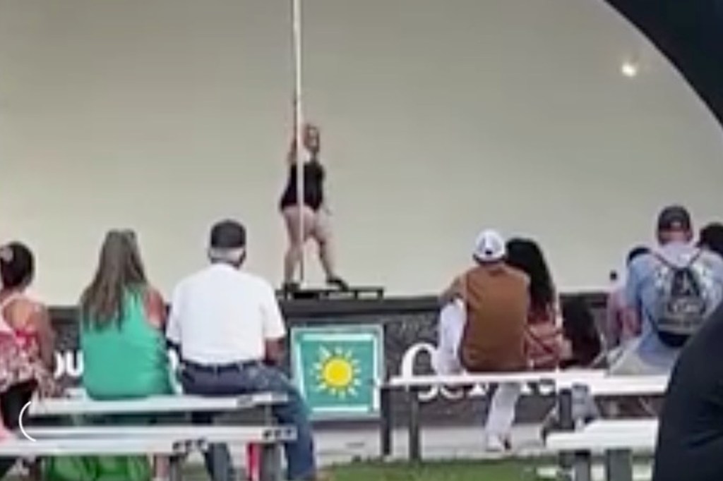 Pole dancer performing on stage at the Colorado State Fair.