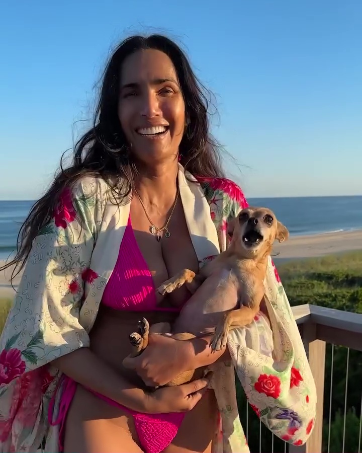 Padma Lakshmi and dog, Divina, at the beach.