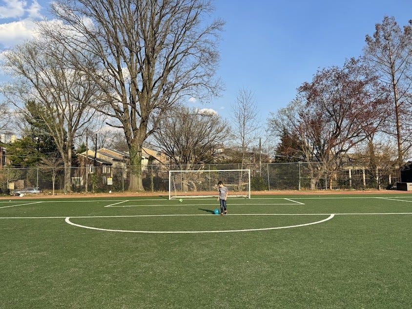 The author's son standing on a soccer field.