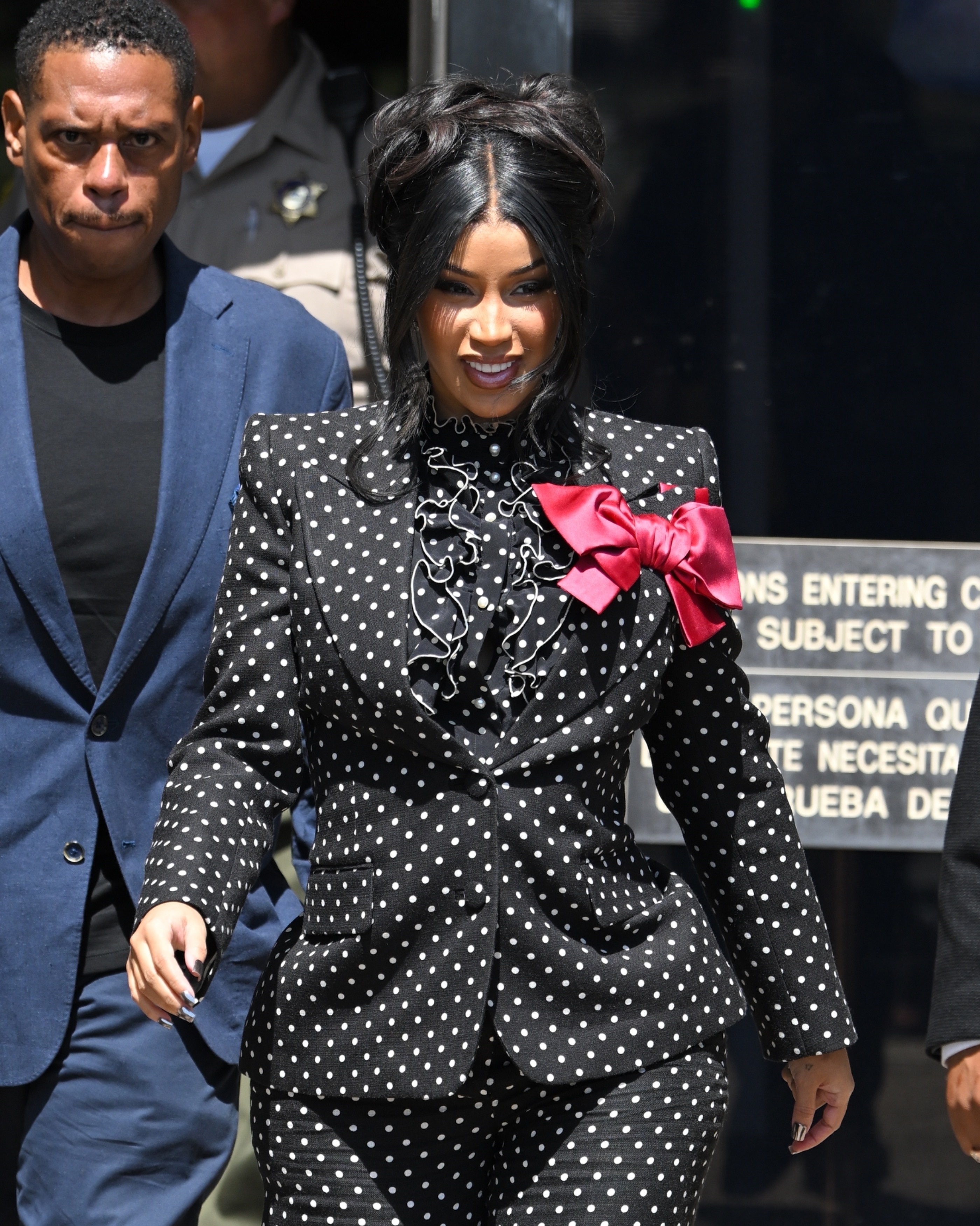 Cardi B in a black polka dot outfit. 