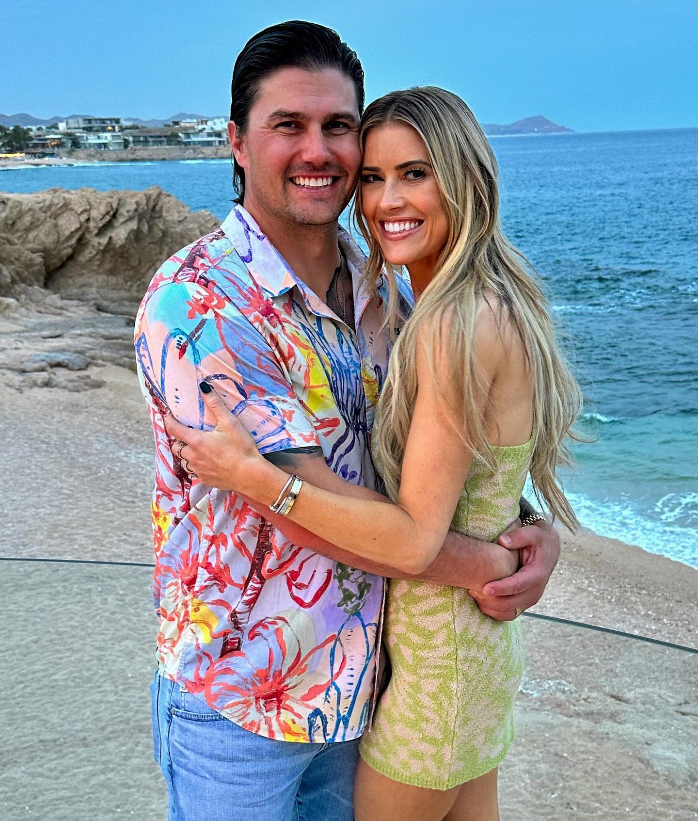 Josh Hall and Christina Haack on the beach. 