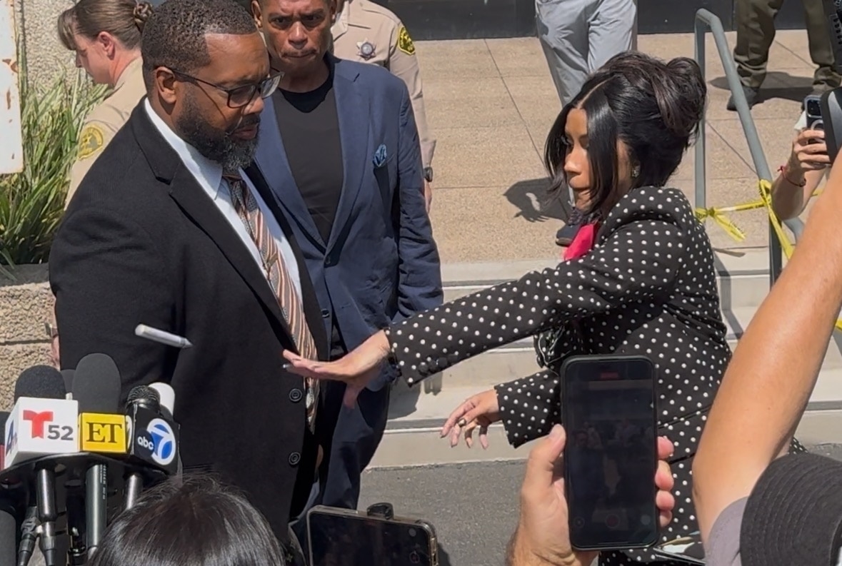 Cardi B throwing a marker outside court. 