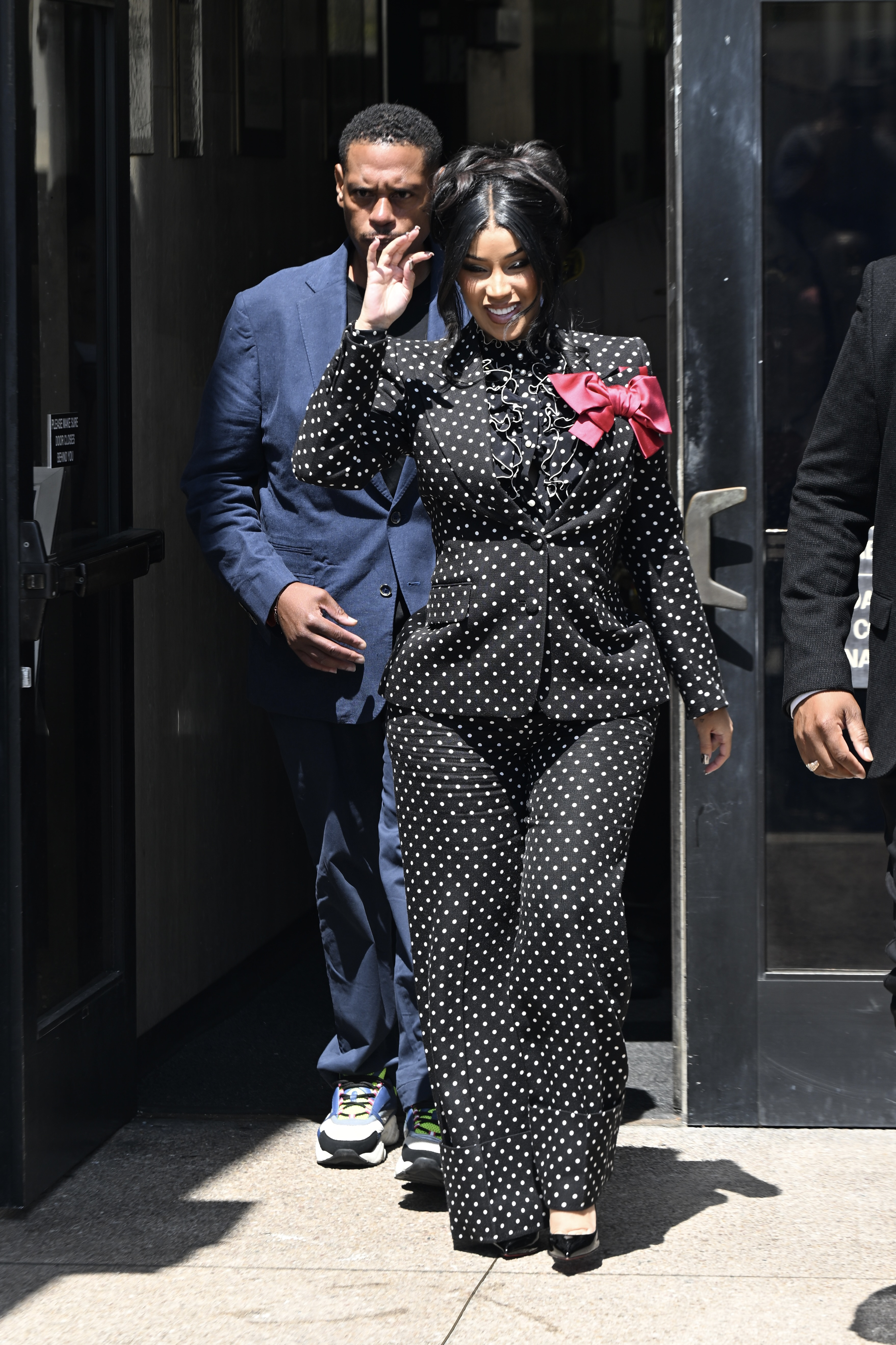 Cardi B in a black suit. 