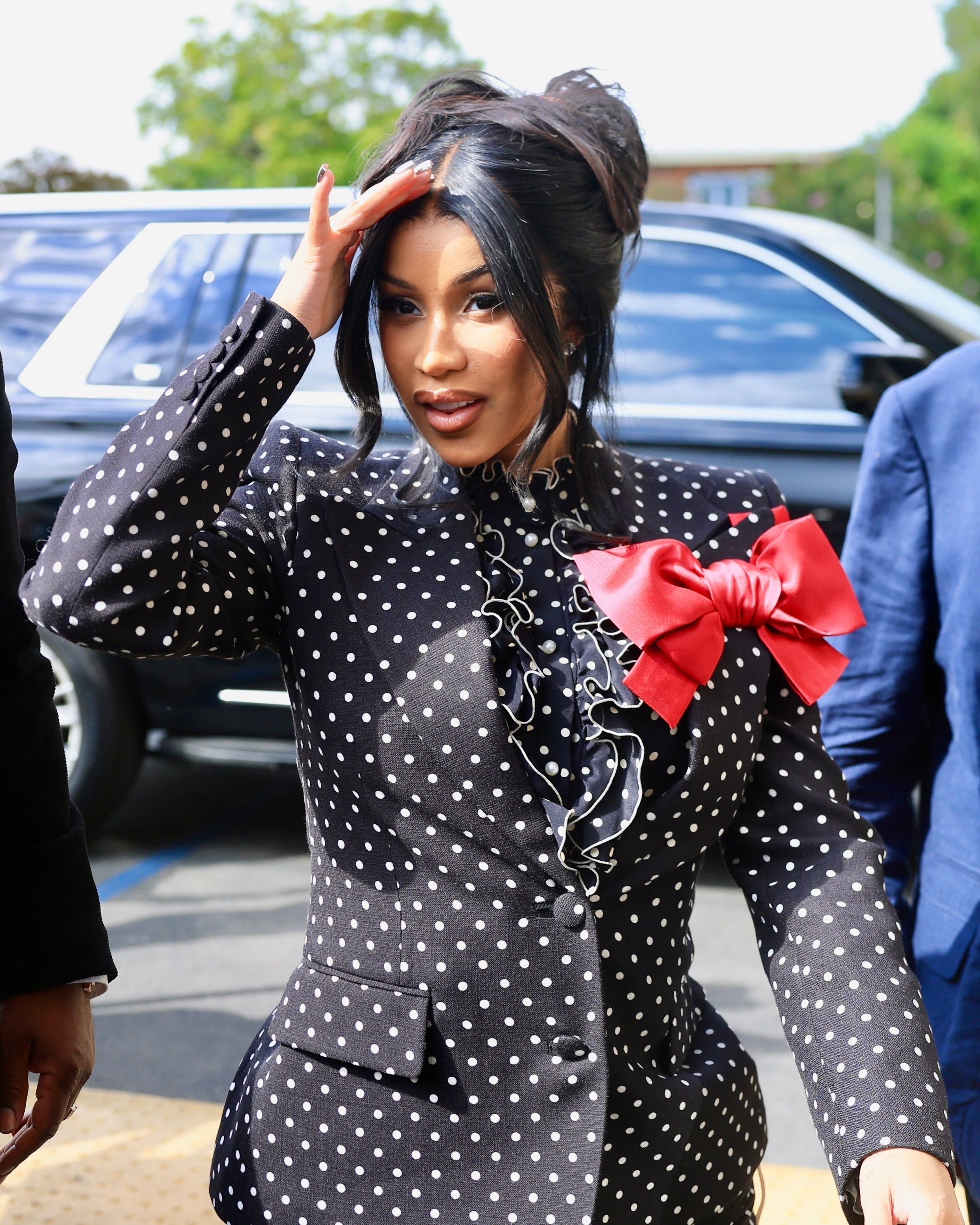 Cardi B in a black polka dot suit. 