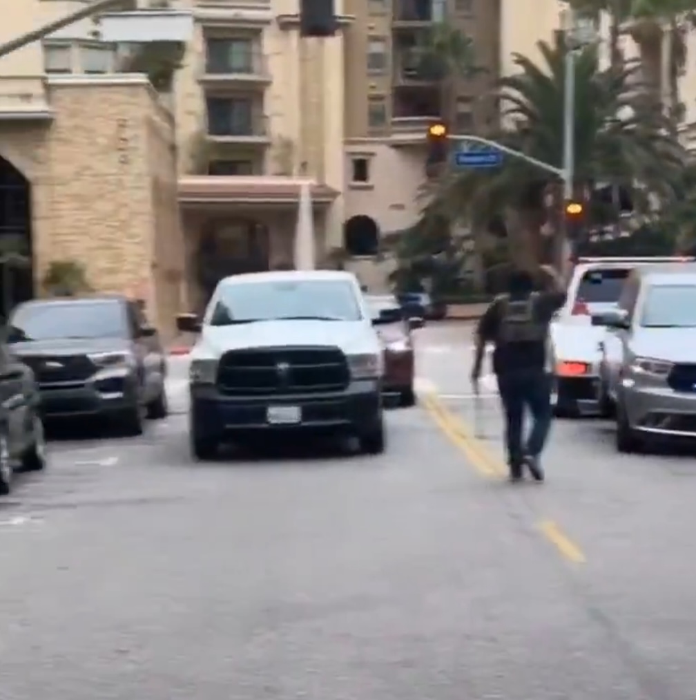 A viral video shows an ICE agent chasing after the government vehicle during the incident.